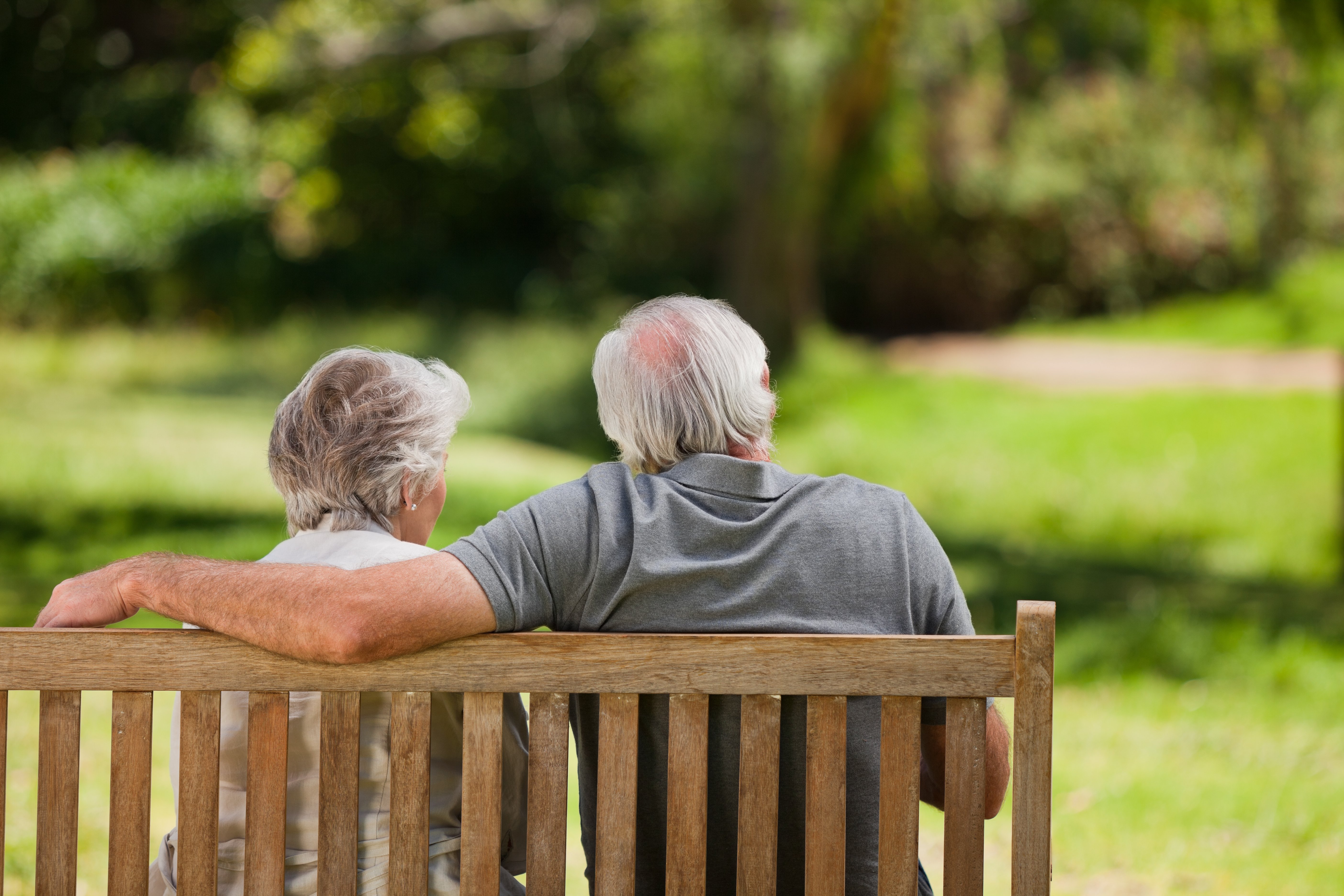 3631925-couple-sitting-on-the-bench-with-their-back-to-the-camera (1).jpg